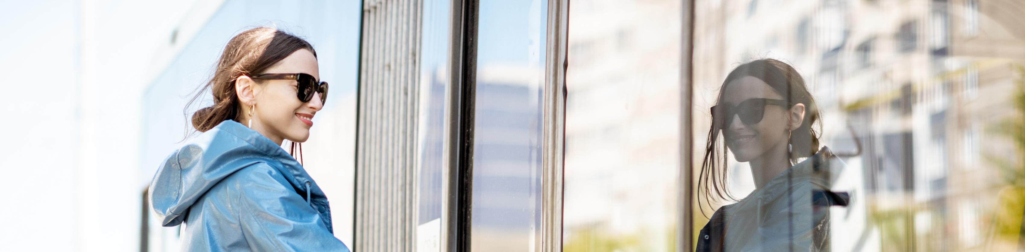 A visually impaired woman entering a public tram